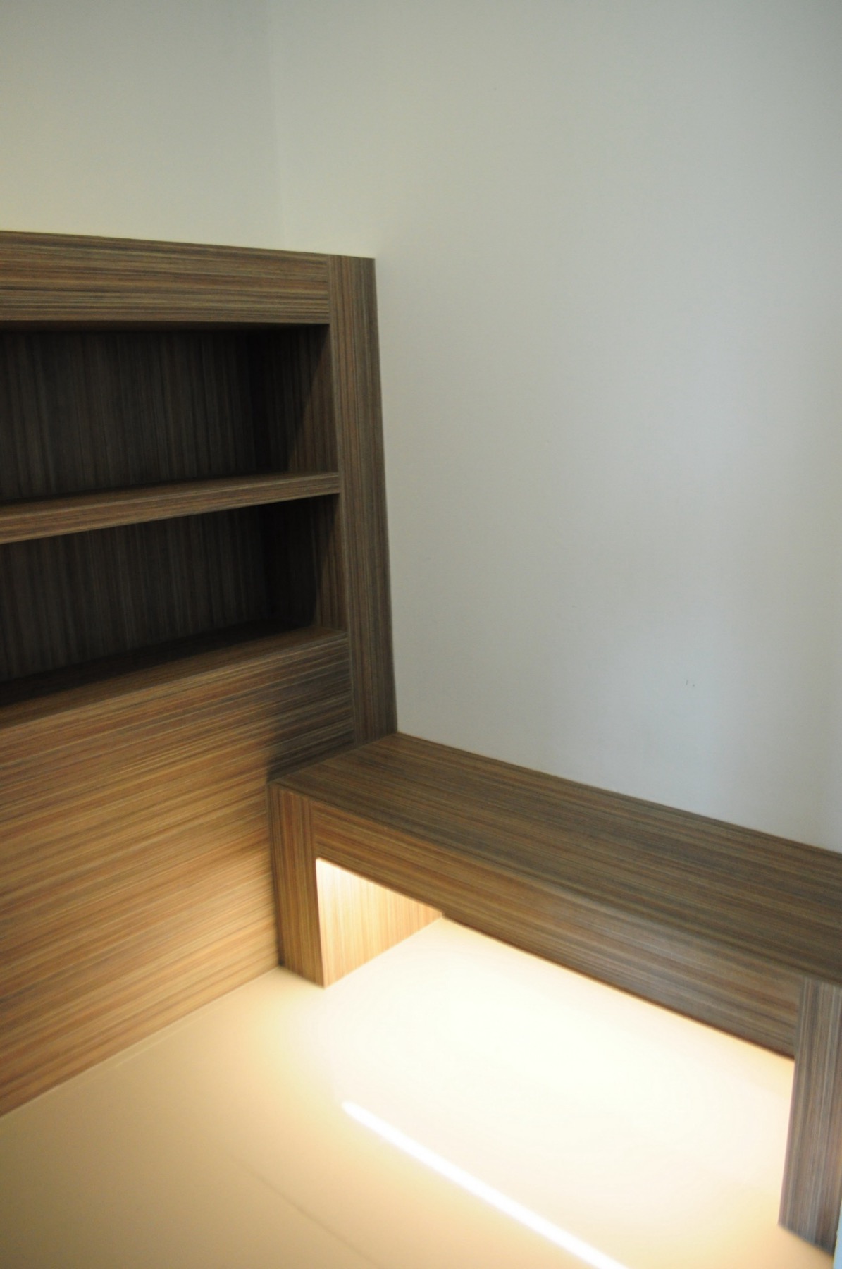 Built-in bench and shelving in the lift lobby
