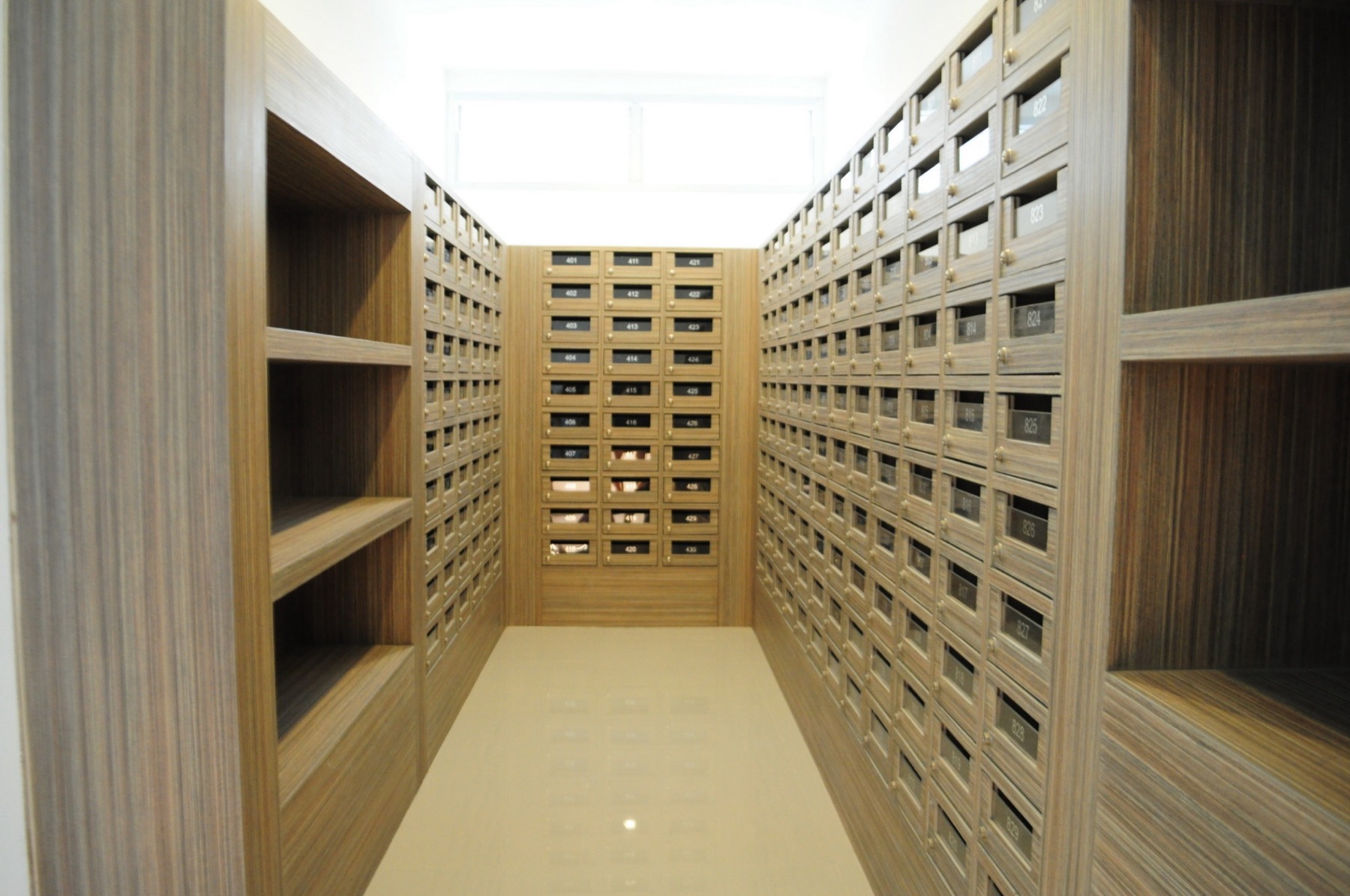 Mail room with individual mailboxes organized by room number