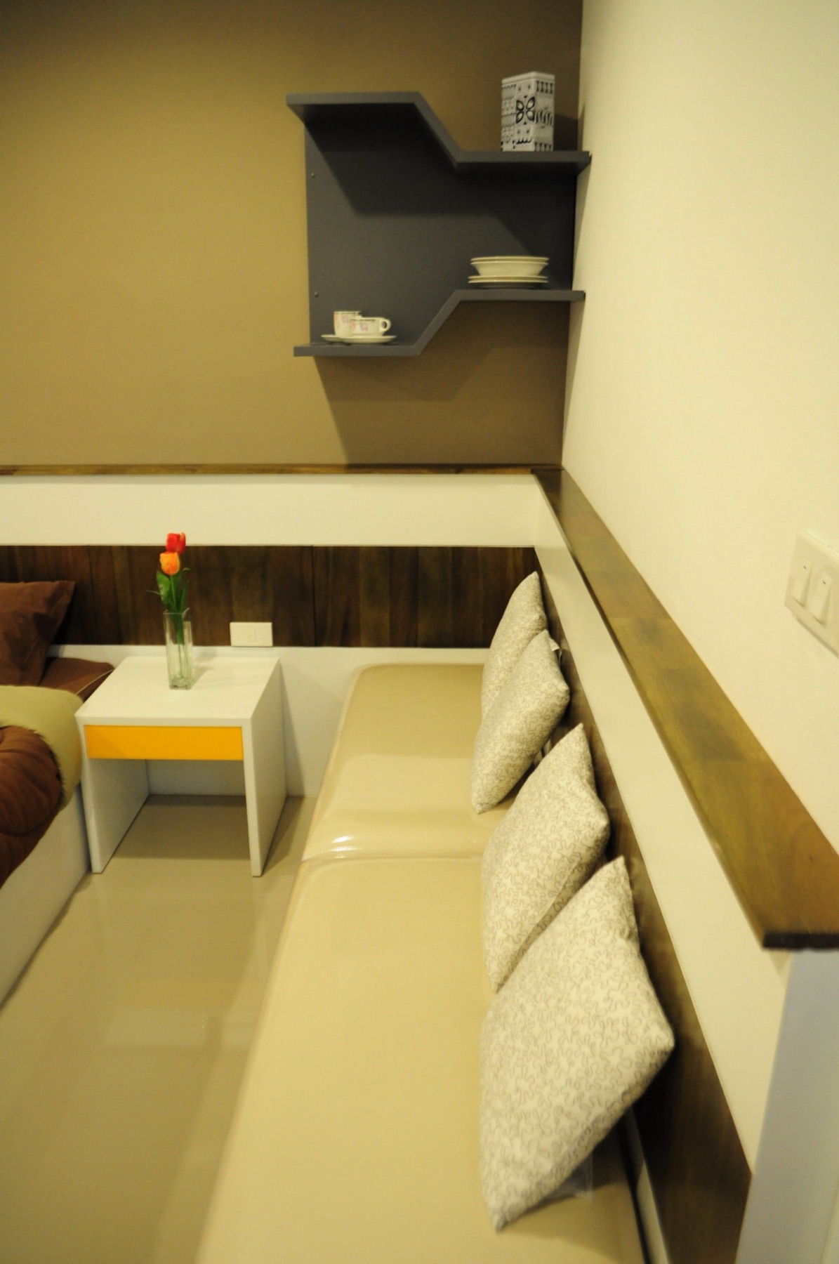 Seating area and bedside table inside the Deluxe room