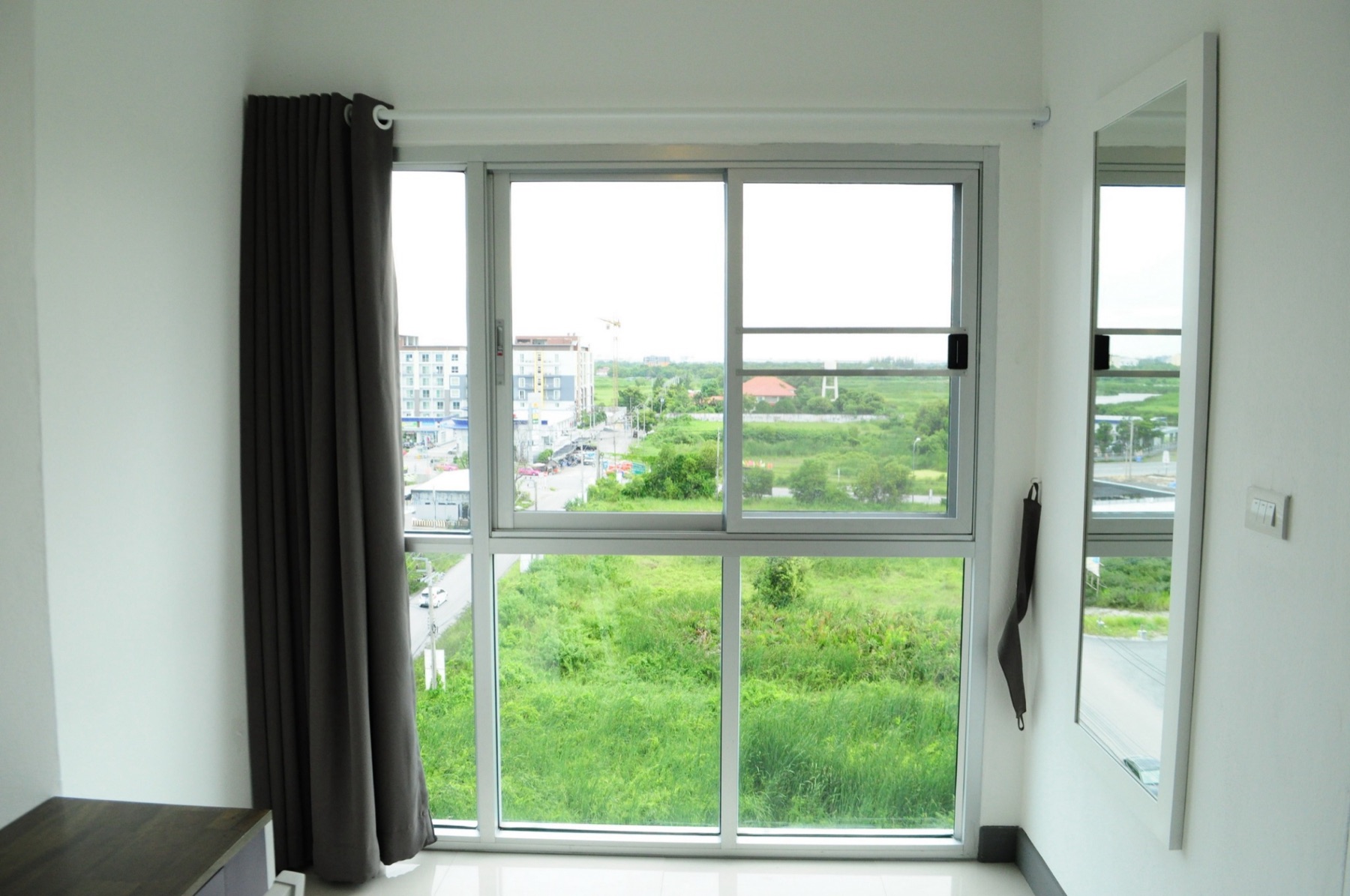Large window and exterior view from the Deluxe room