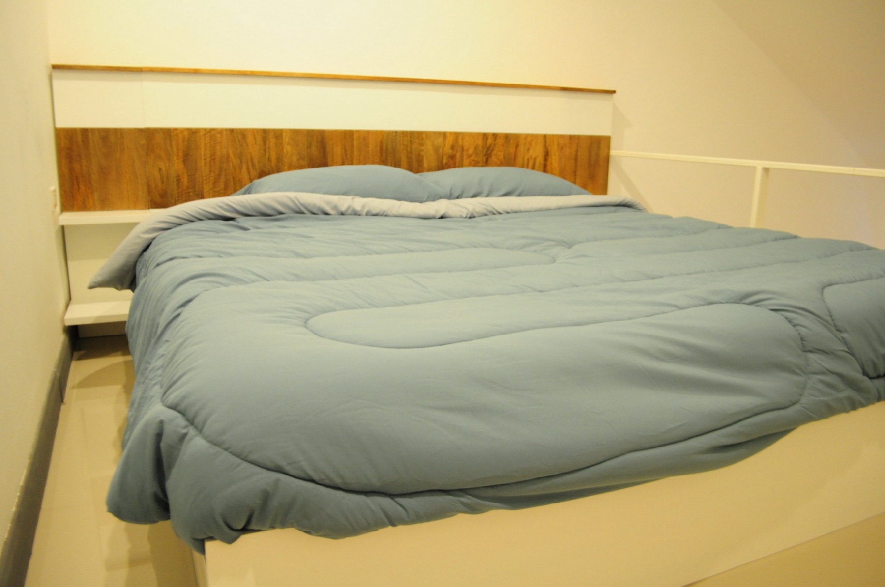 King bed on the upper level of the Loft room