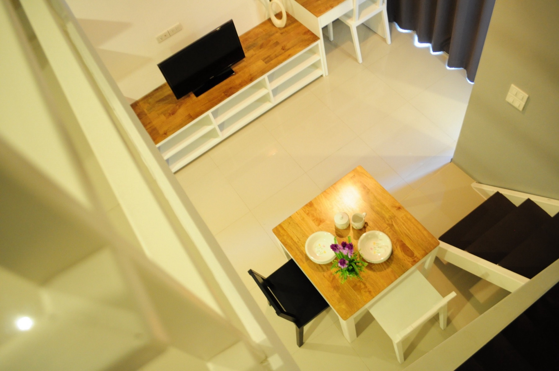 Dining and living areas viewed from the upper level of the Loft room