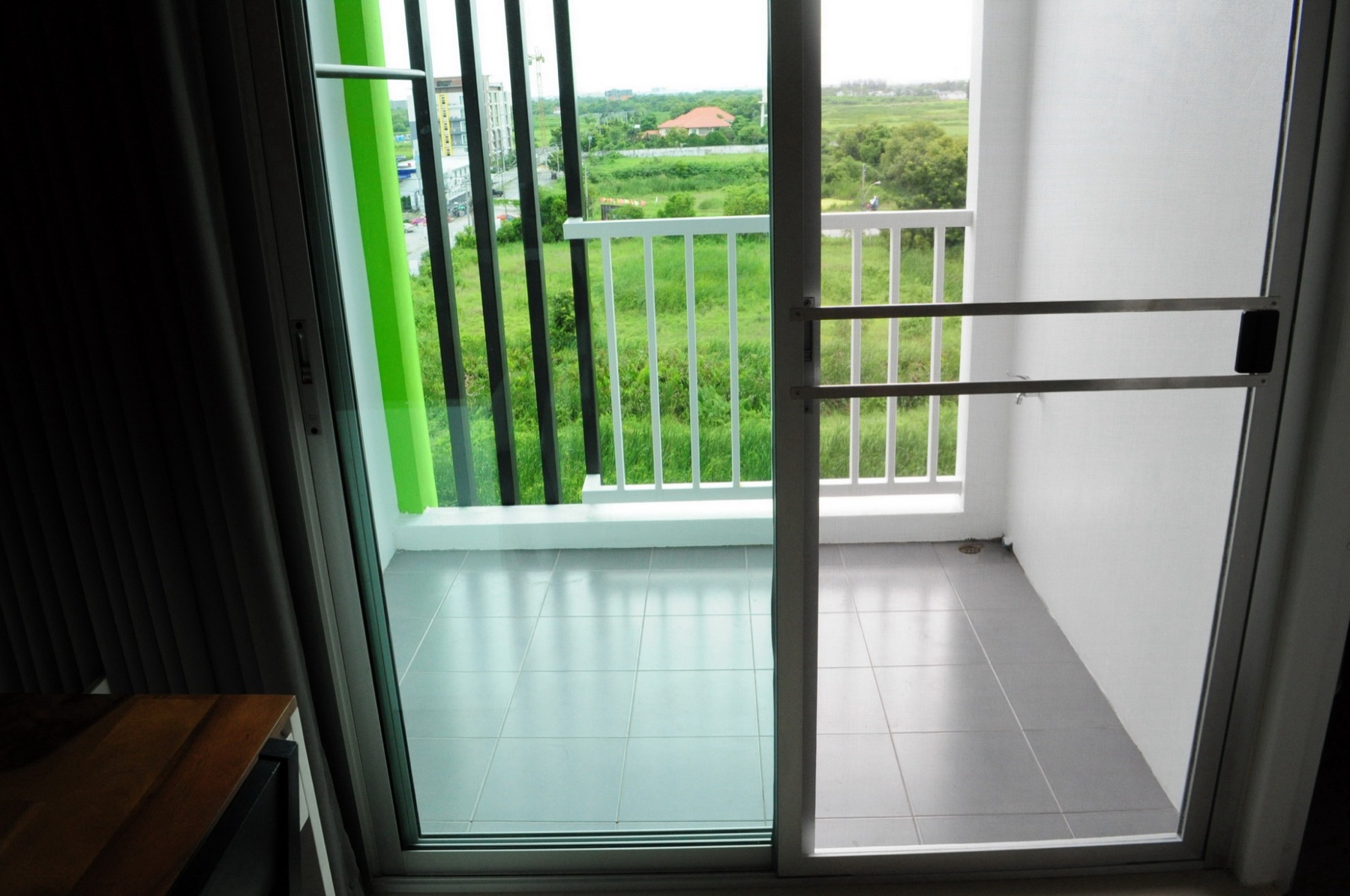 Private balcony and screen door of the Standard room