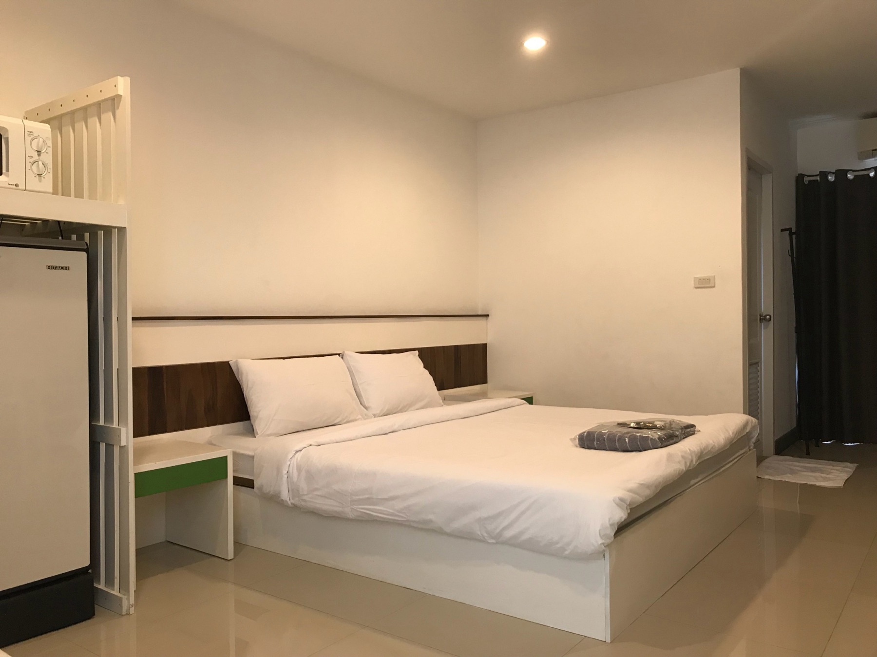 King bed with bedside tables in the Standard room