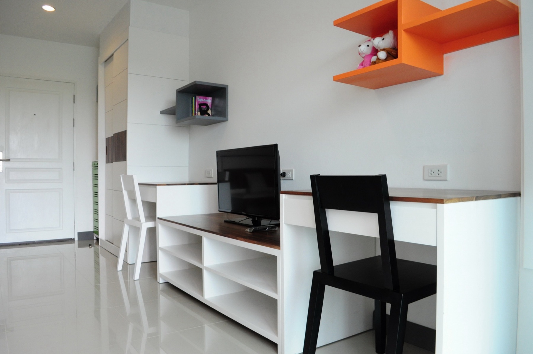 Workspace, television, and storage in the Standard room